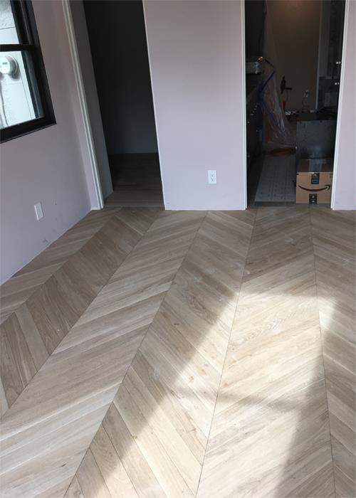 The light in the room is enhanced with the natural finish of the hardwood. Its organic look and feel is contrasted dramatically with the understated craftsmanship.

